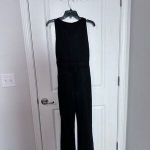 Black sleeveless jumpsuit. Brand new, size large.